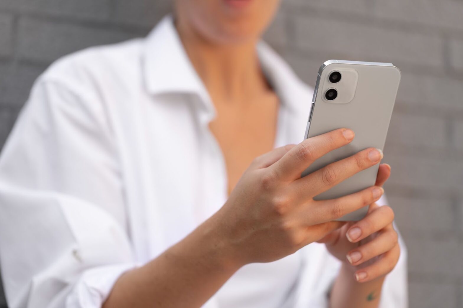 Close up of woman holding phone